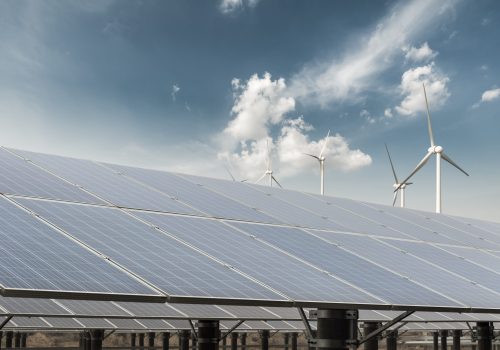 clean energy against a blue sky, solar power plant and wind farm